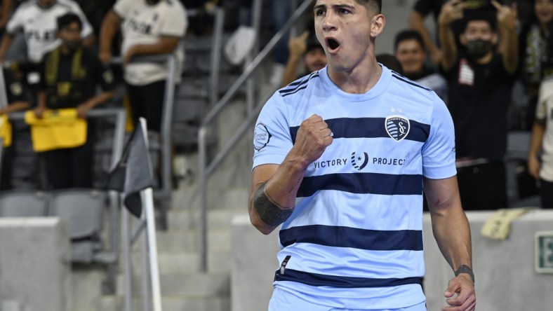 Aug 4, 2021; Los Angeles, CA, Los Angeles, CA, USA;  Sporting Kansas City forward Alan Pulido (9) celebrates after scoring a goal in the first half against Los Angeles FC at Banc of California Stadium. Mandatory Credit: Jayne Kamin-Oncea-USA TODAY Sports