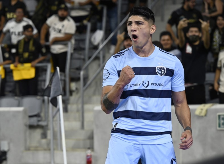 Aug 4, 2021; Los Angeles, CA, Los Angeles, CA, USA;  Sporting Kansas City forward Alan Pulido (9) celebrates after scoring a goal in the first half against Los Angeles FC at Banc of California Stadium. Mandatory Credit: Jayne Kamin-Oncea-USA TODAY Sports
