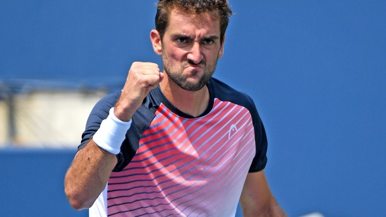 Aug 9, 2021; Toronto, Ontario, Canada; Marin Cilic of Croatia reacts to winning a point against Albert Ramos-Vinolas of Spain in first round play at Aviva Centre. Mandatory Credit: Dan Hamilton-USA TODAY Sports