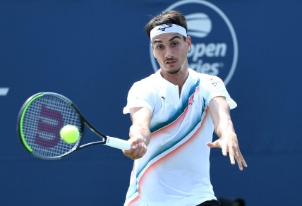Aug 9, 2021; Toronto, Ontario, Canada; Lorenzo Sonego of Italy plays a shot against Ugo Humbert of France in first round play at Aviva Centre. Mandatory Credit: Dan Hamilton-USA TODAY Sports