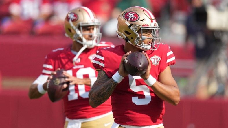 August 14, 2021; Santa Clara, California, USA; San Francisco 49ers quarterback Trey Lance (5) and quarterback Jimmy Garoppolo (10) warm up before the game against the Kansas City Chiefs at Levi's Stadium. Mandatory Credit: Kyle Terada-USA TODAY Sports