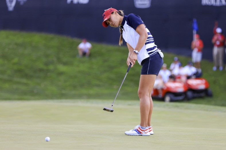 Sep 5, 2021; Toledo, Ohio, USA; Danielle Kang of Team USA putts on the ninth green during competition rounds of the Solheim Cup golf tournament at Inverness Club. Mandatory Credit: Aaron Doster-USA TODAY Sports