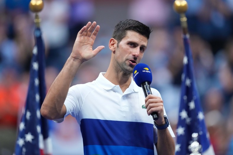 Novak Djokovic of Serbia speaks to the crowd during the trophy presentation ceremony after his match against Daniil Medvedev of Russia (not pictured) in the men's singles final on day fourteen of the 2021 U.S. Open tennis tournament at USTA Billie Jean King National Tennis Center. Mandatory Credit: Danielle Parhizkaran-USA TODAY Sports