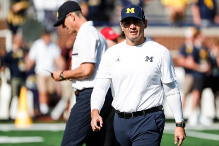 Michigan defensive coordinator Mike Macdonald watches warm up before a game against Northern Illinois at Michigan Stadium in Ann Arbor on Saturday, Sept. 18, 2021.