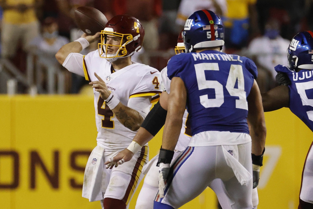 Sep 16, 2021; Landover, Maryland, USA; Washington Football Team quarterback Taylor Heinicke (4) passes the ball against the New York Giants at FedExField. Mandatory Credit: Geoff Burke-USA TODAY Sports