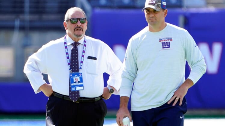 New York Giants general manager Dave Gettleman, left, and head coach Joe Judge talk on the field before the game at MetLife Stadium on Sunday, Sept. 26, 2021, in East Rutherford.Nyg Vs Atl