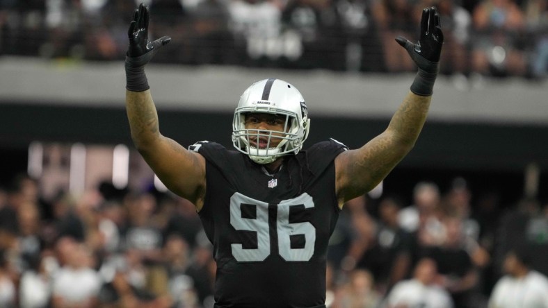 Sep 26, 2021; Paradise, Nevada, USA; Las Vegas Raiders defensive tackle Darius Philon (96) celebrates in the second half against the Miami Dolphinsat Allegiant Stadium.The Raiders defeated the Dolphins 31-28 in overtime. Mandatory Credit: Kirby Lee-USA TODAY Sports