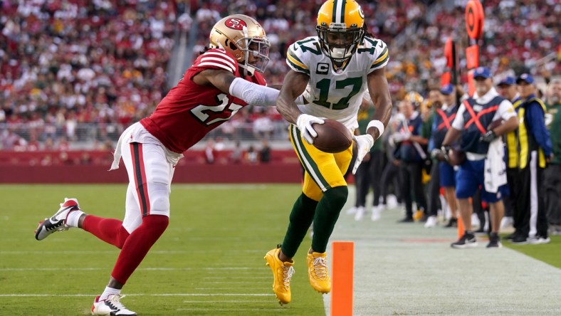 Sep 26, 2021; Santa Clara, California, USA; Green Bay Packers wide receiver Davante Adams (17) is tackled short of the end zone by San Francisco 49ers defensive back Dontae Johnson (27) after making a catch in the second quarter at Levi's Stadium. Mandatory Credit: Cary Edmondson-USA TODAY Sports