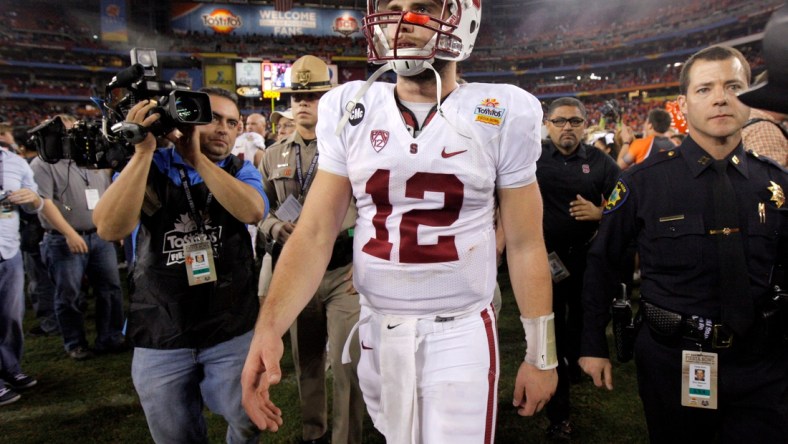 Stanford's Andrew Luck (12) walks of the field after losing the Fiesta Bowl between the Oklahoma State University Cowboys (OSU) and the Stanford Cardinal at the University of Phoenix Stadium in Glendale, Ariz., Tuesday, Jan. 3, 2012.

Osu101