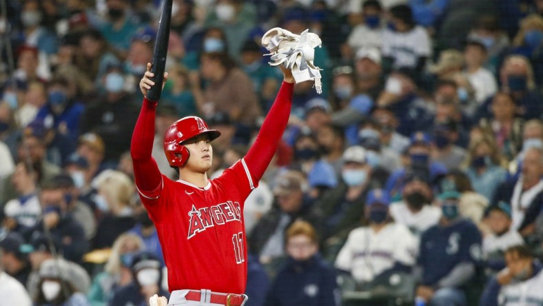 Oct 3, 2021; Seattle, Washington, USA; Los Angeles Angels designated hitter Shohei Ohtani (17) signals the bat boy after drawing an intentional walk against the Seattle Mariners during the second inning at T-Mobile Park. Mandatory Credit: Joe Nicholson-USA TODAY Sports