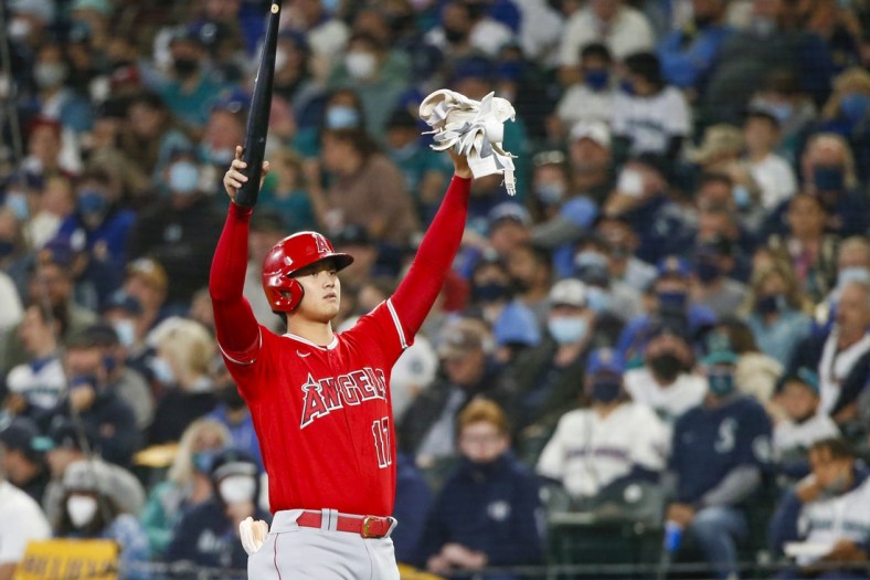 Oct 3, 2021; Seattle, Washington, USA; Los Angeles Angels designated hitter Shohei Ohtani (17) signals the bat boy after drawing an intentional walk against the Seattle Mariners during the second inning at T-Mobile Park. Mandatory Credit: Joe Nicholson-USA TODAY Sports