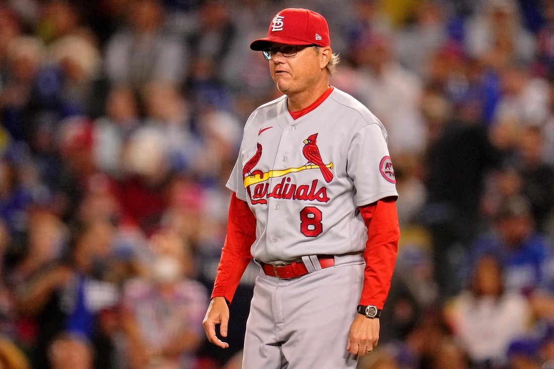 Oct 6, 2021; Los Angeles, California, USA; St. Louis Cardinals manager Mike Shildt (8) walks onto the field to take starting pitcher Adam Wainwright (not pictured) out of the game against the Los Angeles Dodgers during the sixth inning at Dodger Stadium. Mandatory Credit: Robert Hanashiro-USA TODAY Sports