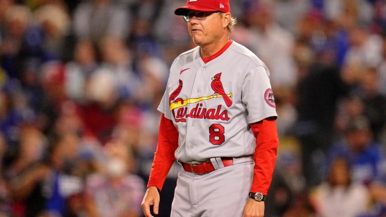 Oct 6, 2021; Los Angeles, California, USA; St. Louis Cardinals manager Mike Shildt (8) walks onto the field to take starting pitcher Adam Wainwright (not pictured) out of the game against the Los Angeles Dodgers during the sixth inning at Dodger Stadium. Mandatory Credit: Robert Hanashiro-USA TODAY Sports