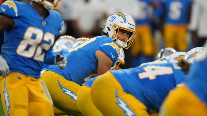 Oct 4, 2021; Inglewood, California, USA; Los Angeles Chargers quarterback Justin Herbert (10) prepares to take the snap against the Las Vegas Raiders at SoFi Stadium. The Chargers defeated the Raiders 28-14. Mandatory Credit: Kirby Lee-USA TODAY Sports