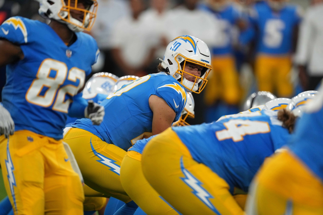Oct 4, 2021; Inglewood, California, USA; Los Angeles Chargers quarterback Justin Herbert (10) prepares to take the snap against the Las Vegas Raiders at SoFi Stadium. The Chargers defeated the Raiders 28-14. Mandatory Credit: Kirby Lee-USA TODAY Sports