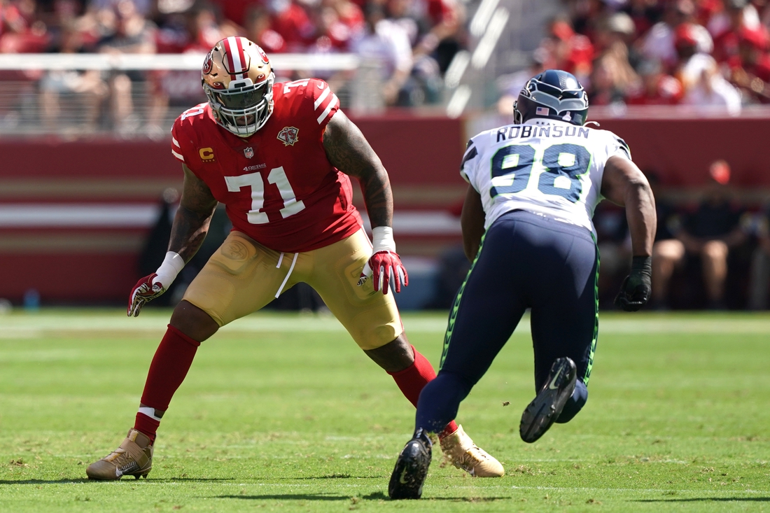 Oct 3, 2021; Santa Clara, California, USA; San Francisco 49ers offensive tackle Trent Williams (71) blocks Seattle Seahawks defensive end Alton Robinson (98) during the first quarter at Levi's Stadium. Mandatory Credit: Darren Yamashita-USA TODAY Sports