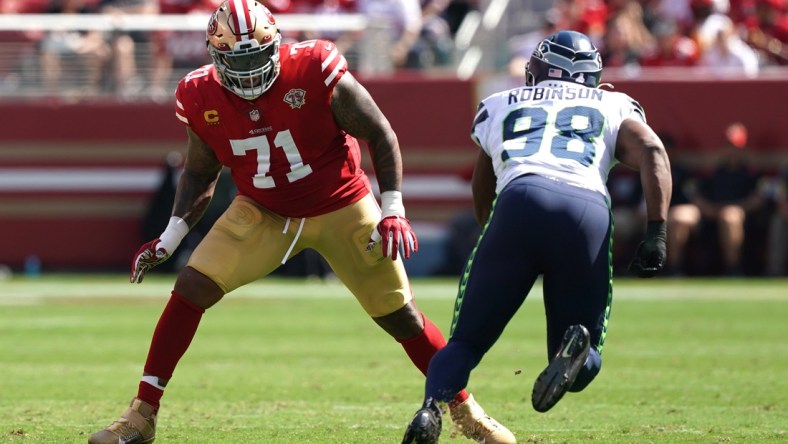 Oct 3, 2021; Santa Clara, California, USA; San Francisco 49ers offensive tackle Trent Williams (71) blocks Seattle Seahawks defensive end Alton Robinson (98) during the first quarter at Levi's Stadium. Mandatory Credit: Darren Yamashita-USA TODAY Sports