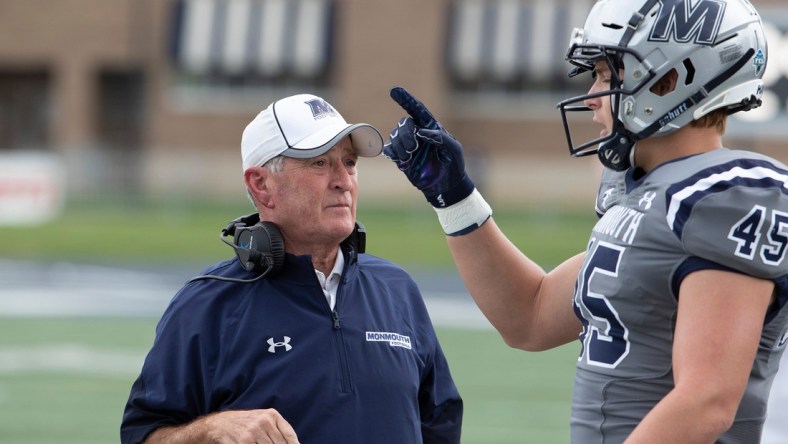 Monmouth Head Coach Kevin Callahan talks with Remi Johnson during break in first half action. Monmouth University Football vs Princeton on October 9, 2021 in West Long Branch, NJ.

Mufb211009i