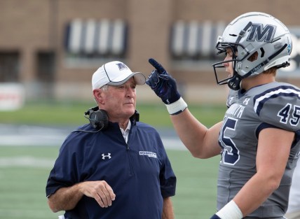 Monmouth Head Coach Kevin Callahan talks with Remi Johnson during break in first half action. Monmouth University Football vs Princeton on October 9, 2021 in West Long Branch, NJ.

Mufb211009i
