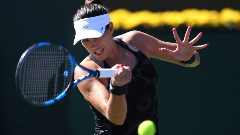 Oct 9, 2021; Indian Wells, CA, USA; Garbine Muguruza (ESP) hits a shot against Ajla Tomljanovic (AUS) at Indian Wells Tennis Garden. Mandatory Credit: Orlando Ramirez-USA TODAY Sports