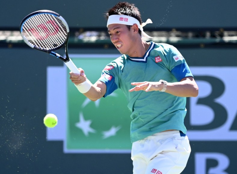 Oct 9, 2021; Indian Wells, CA, USA;  Kei Nishikori (JPN) hits a shot during his second round match against Daniel Evans (GER) during the BNP Paribas Open at the Indian Wells Tennis Garden. Mandatory Credit: Jayne Kamin-Oncea-USA TODAY Sports