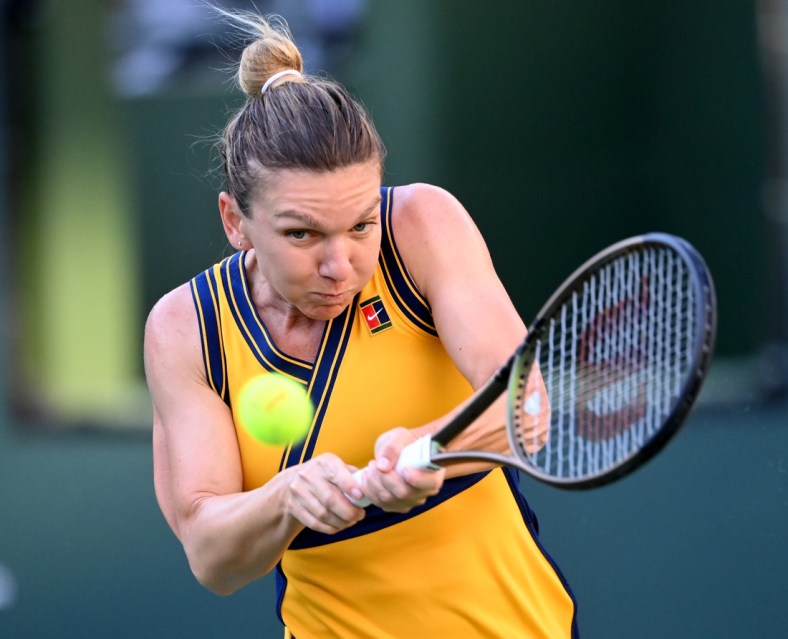 Oct 10, 2021; Indian Wells, CA, USA; Simona Halep (ROU) hits a shot in her second round match against Aliaksandra Sasnovich (BLR) during the BNP Paribas Open at the Indian Wells Tennis Garden. Mandatory Credit: Jayne Kamin-Oncea-USA TODAY Sports