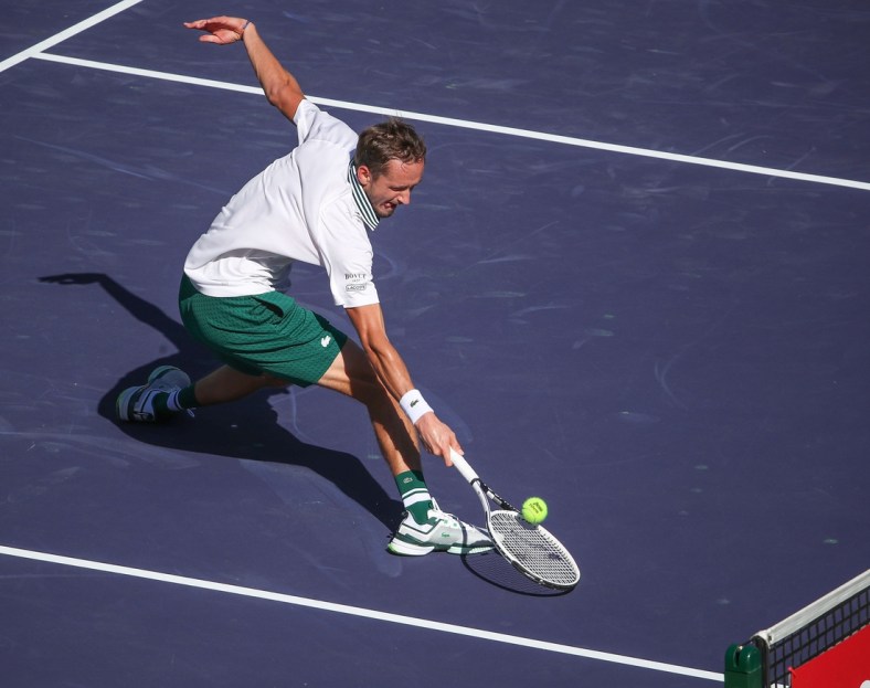 Daniil Medvedev reaches for a shot at the net but double hits it during his match against Grigor Dimitrov at the BNP Paribas Open in Indian Wells, October 13, 2021.

Bnp Wed 1