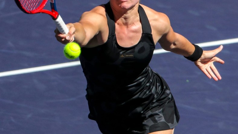 Elena Rybakina of Kazakhstan returns while playing against Su-Wei Hsieh of Taiwan and Elise Mertens of Belgium with doubles partner Veronika Kudermetova of Russia during the women's doubles final of the BNP Paribas Open at the Indian Wells Tennis Garden, Saturday, Oct. 16, 2021, in Indian Wells, Calif.