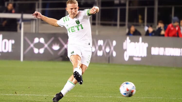 Oct 20, 2021; San Jose, California, USA; Austin FC midfielder Alex Ring (8) passes the ball against the San Jose Earthquakes during the first half at PayPal Park. Mandatory Credit: Kelley L Cox-USA TODAY Sports