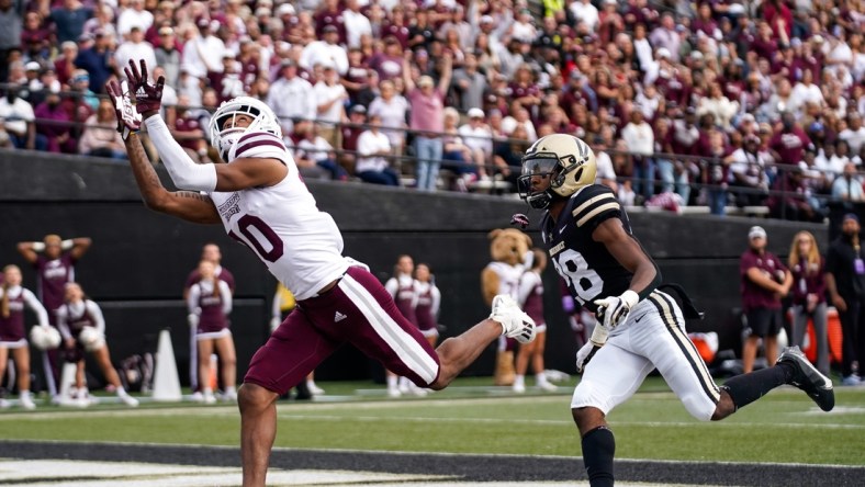 Mississippi State wide receiver Makai Polk (10) receives a pass for a touchdown past Vanderbilt cornerback Allan George (28) during the second quarter at Vanderbilt Stadium in Nashville, Tenn., Saturday, Oct. 23, 2021.

Vandy Missst Fb 102321 An 008