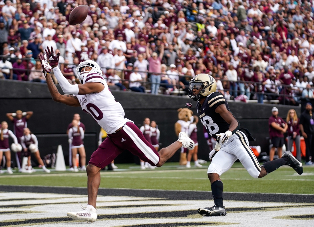 Mississippi State wide receiver Makai Polk (10) receives a pass for a touchdown past Vanderbilt cornerback Allan George (28) during the second quarter at Vanderbilt Stadium in Nashville, Tenn., Saturday, Oct. 23, 2021.

Vandy Missst Fb 102321 An 008