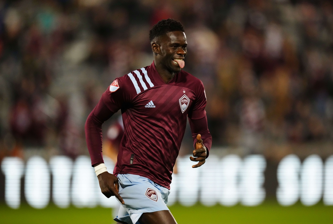 Oct 23, 2021; Commerce City, Colorado, USA; Colorado Rapids forward Dominique Badji (8) celebrates his goal in the first half against the Portland Timbers at Dick's Sporting Goods Park. Mandatory Credit: Ron Chenoy-USA TODAY Sports