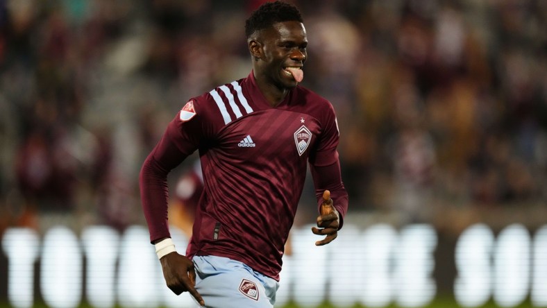 Oct 23, 2021; Commerce City, Colorado, USA; Colorado Rapids forward Dominique Badji (8) celebrates his goal in the first half against the Portland Timbers at Dick's Sporting Goods Park. Mandatory Credit: Ron Chenoy-USA TODAY Sports