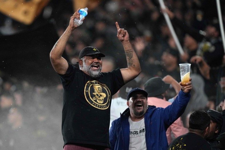 Oct 26, 2021; Los Angeles, California, USA; LAFC fans hold react in the first half against the Seattle Sounders at Banc of California Stadium. Mandatory Credit: Kirby Lee-USA TODAY Sports