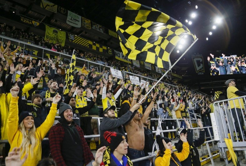 Oct 27, 2021; Columbus, Ohio, USA; Columbus Crew fans in the Nordecke celebrate following a 3-2 victory over Orlando City at Lower.com Field. Mandatory Credit: Adam Cairns/Columbus Dispatch via USA TODAY NETWORK