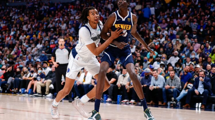 Oct 29, 2021; Denver, Colorado, USA; Dallas Mavericks center Moses Brown (9) and Denver Nuggets center Bol Bol (10) battle for position in the fourth quarter at Ball Arena. Mandatory Credit: Isaiah J. Downing-USA TODAY Sports