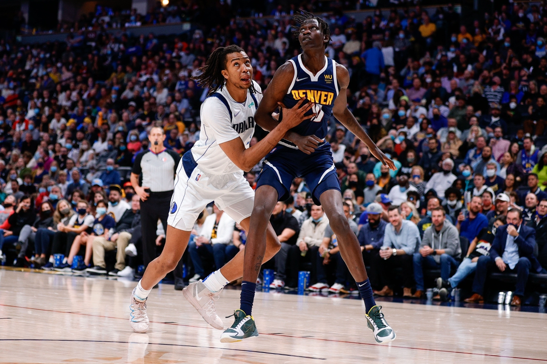 Oct 29, 2021; Denver, Colorado, USA; Dallas Mavericks center Moses Brown (9) and Denver Nuggets center Bol Bol (10) battle for position in the fourth quarter at Ball Arena. Mandatory Credit: Isaiah J. Downing-USA TODAY Sports