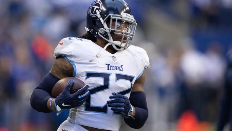 Oct 31, 2021; Indianapolis, Indiana, USA; Tennessee Titans running back Derrick Henry (22) runs the ball during warm ups against the Indianapolis Colts at Lucas Oil Stadium. Mandatory Credit: Trevor Ruszkowski-USA TODAY Sports