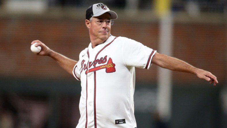 Oct 31, 2021; Atlanta, Georgia, USA; Atlanta Braves hall of fame pitcher Greg Maddux throws out the ceremonial first pitch prior to game five of the 2021 World Series against the Houston Astros at Truist Park. Mandatory Credit: Brett Davis-USA TODAY Sports