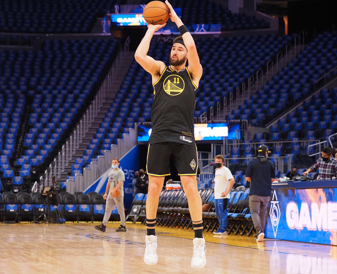 Nov 3, 2021; San Francisco, California, USA; Golden State Warriors guard Klay Thompson (11) warms up before the game against the Charlotte Hornets at Chase Center. Mandatory Credit: Kelley L Cox-USA TODAY Sports