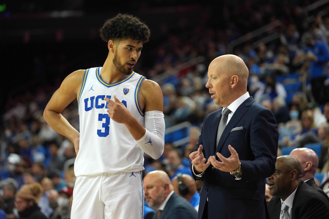 Nov 4, 2021; Los Angeles, CA, USA; UCLA Bruins head coach Mick Cronin (right) talks with guard Johnny Juzang (3) the Chico State  in the second  half at Pauley Pavilion.  Mandatory Credit: Kirby Lee-USA TODAY Sports