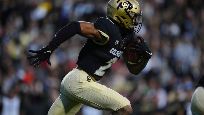 Nov 6, 2021; Boulder, Colorado, USA; Colorado Buffaloes wide receiver Brenden Rice (2) carries the ball in the second quarter against the Oregon State Beavers  at Folsom Field. Mandatory Credit: Ron Chenoy-USA TODAY Sports