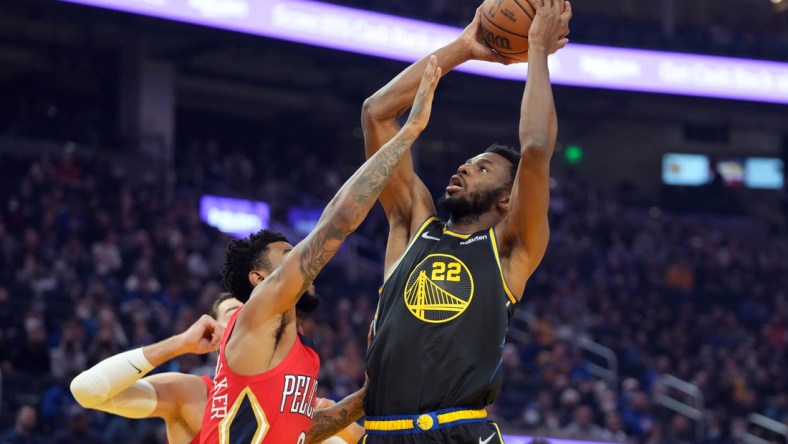 Nov 5, 2021; San Francisco, California, USA; Golden State Warriors forward Andrew Wiggins (22) shoots over New Orleans Pelicans guard Nickeil Alexander-Walker (6) during the first quarter at Chase Center. Mandatory Credit: Darren Yamashita-USA TODAY Sports