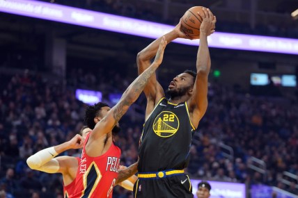 Nov 5, 2021; San Francisco, California, USA; Golden State Warriors forward Andrew Wiggins (22) shoots over New Orleans Pelicans guard Nickeil Alexander-Walker (6) during the first quarter at Chase Center. Mandatory Credit: Darren Yamashita-USA TODAY Sports