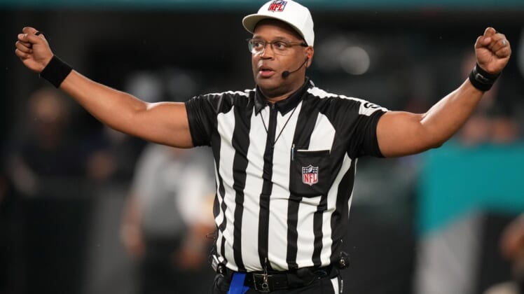 Nov 11, 2021; Miami Gardens, Florida, USA; NFL referee Ron Torbert (62) signals during the second half between the Miami Dolphins and the Baltimore Ravens at Hard Rock Stadium. Mandatory Credit: Jasen Vinlove-USA TODAY Sports