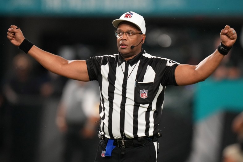 Nov 11, 2021; Miami Gardens, Florida, USA; NFL referee Ron Torbert (62) signals during the second half between the Miami Dolphins and the Baltimore Ravens at Hard Rock Stadium. Mandatory Credit: Jasen Vinlove-USA TODAY Sports