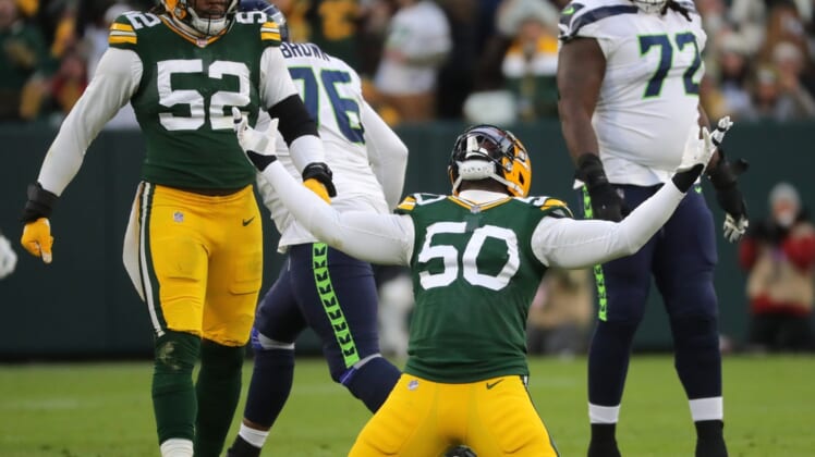 Green Bay Packers defensive end Whitney Mercilus (50) celebrates his sack of Seattle Seahawks quarterback Russell Wilson during the first quarter of their game Sunday, November 14, 2021 at Lambeau Field in Green Bay, Wis. The Green Bay Packers beat the Seattle Seahawks 17-0.Packers15 11