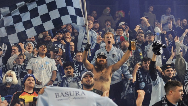 Nov 20, 2021; Kansas City, KS, USA; Sporting Kansas City fans cheer after the team beat the Vancouver Whitecaps in a round one MLS Playoff game at Children's Mercy Park. Mandatory Credit: Amy Kontras-USA TODAY Sports