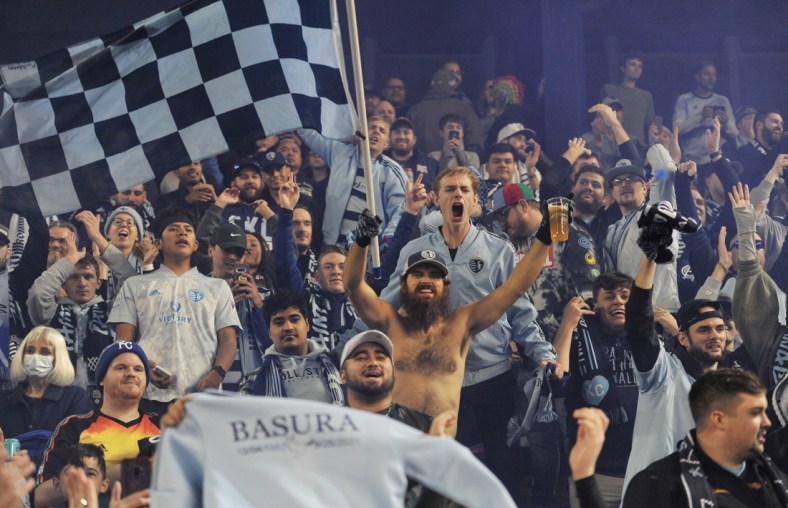 Nov 20, 2021; Kansas City, KS, USA; Sporting Kansas City fans cheer after the team beat the Vancouver Whitecaps in a round one MLS Playoff game at Children's Mercy Park. Mandatory Credit: Amy Kontras-USA TODAY Sports