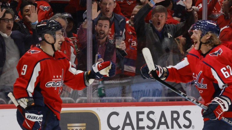 Nov 24, 2021; Washington, District of Columbia, USA; Washington Capitals defenseman Dmitry Orlov (9) celebrates with Capitals left wing Carl Hagelin (62) after scoring a goal against the Montreal Canadiens during the third period at Capital One Arena. Mandatory Credit: Geoff Burke-USA TODAY Sports